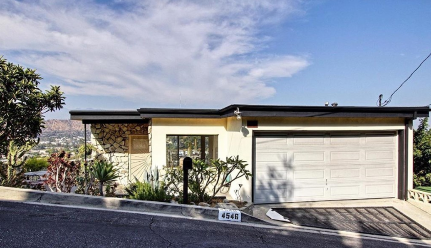 Perched on a breathtaking hilltop, with 180 degree views of Glendale, Eagle Rock, Highland Park, Glassell Park and Mt. Washington, this mid-century home is straight out of a classic film